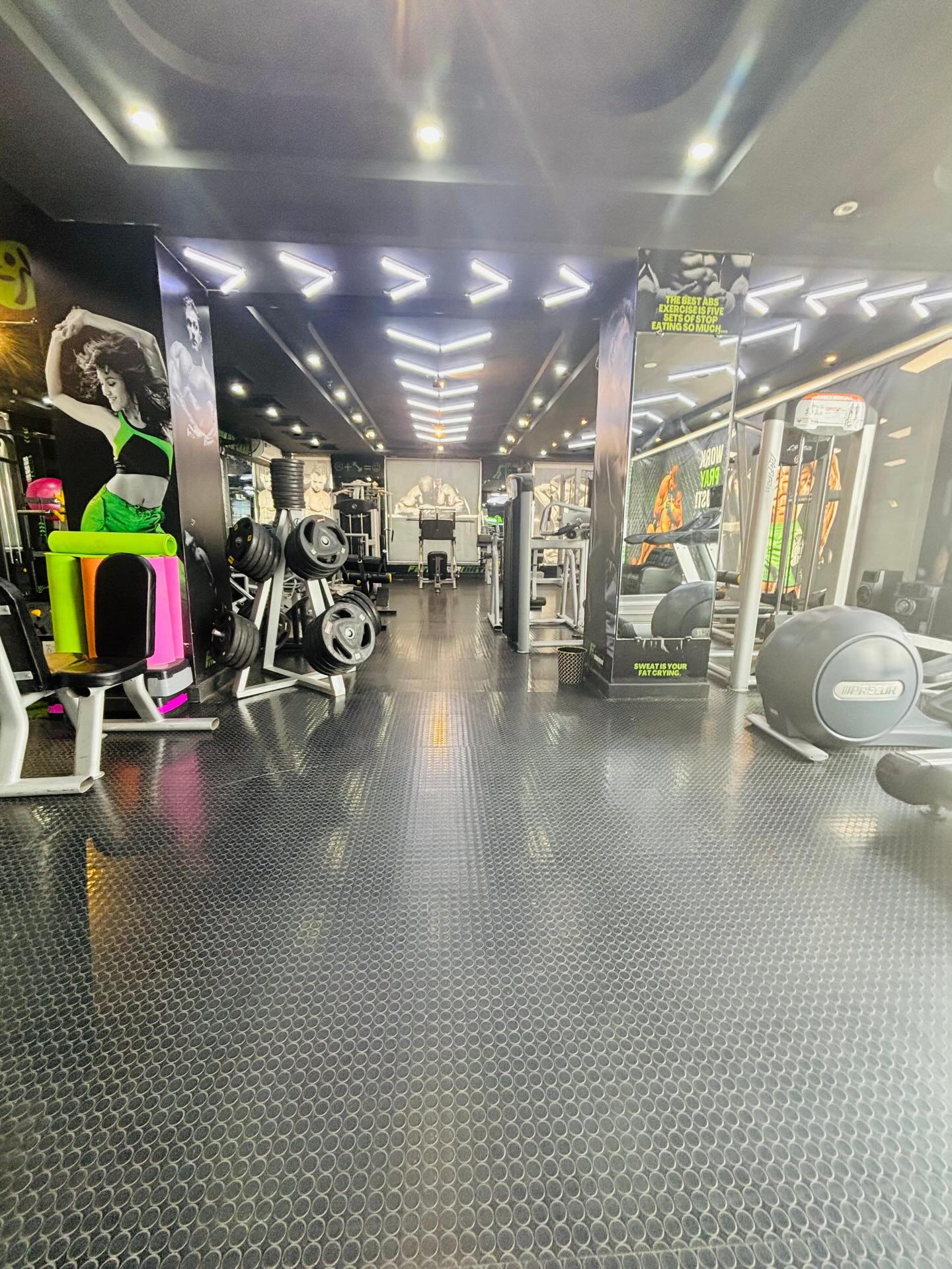 The cardio and Zumba end of the floor with mirrored walls